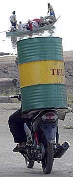 Motorbike Driver with a Barrel on his Backseat by Asienreisender